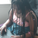 4th grade girl with laptop doing work